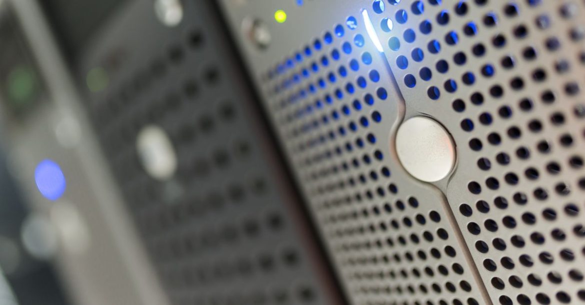 Close-up of rack server hardware with blue status LEDs illustrating linux server hardening in a data centre environment
