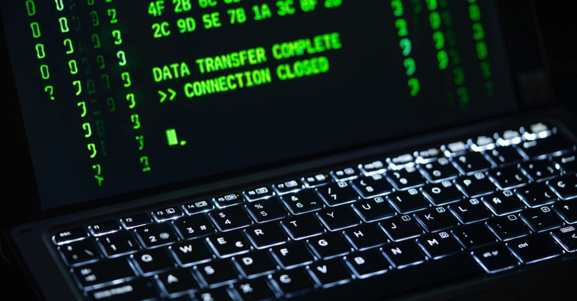 Ransomware ransom note on a laptop screen illustrating how ransomware works to encrypt and steal data