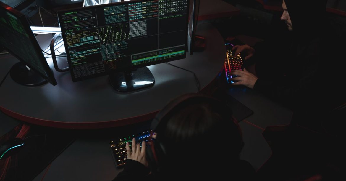 Security researchers at a terminal analysing virus vs worm malware propagation