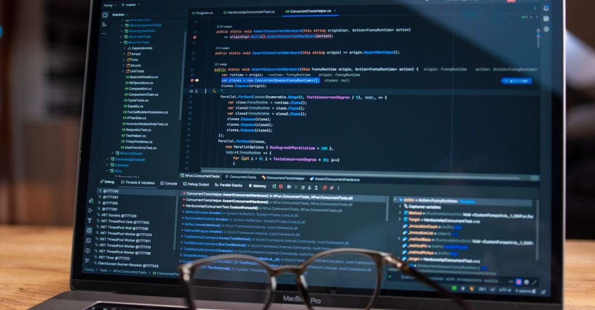 Developer debugging code on a laptop screen while checking for the Fastjson RCE vulnerability