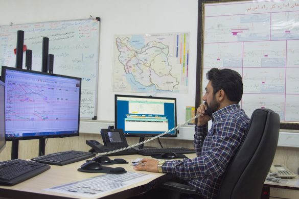 IT administrator reviewing multiple monitors in a network operations room after a SmartConsole authentication bypass alert