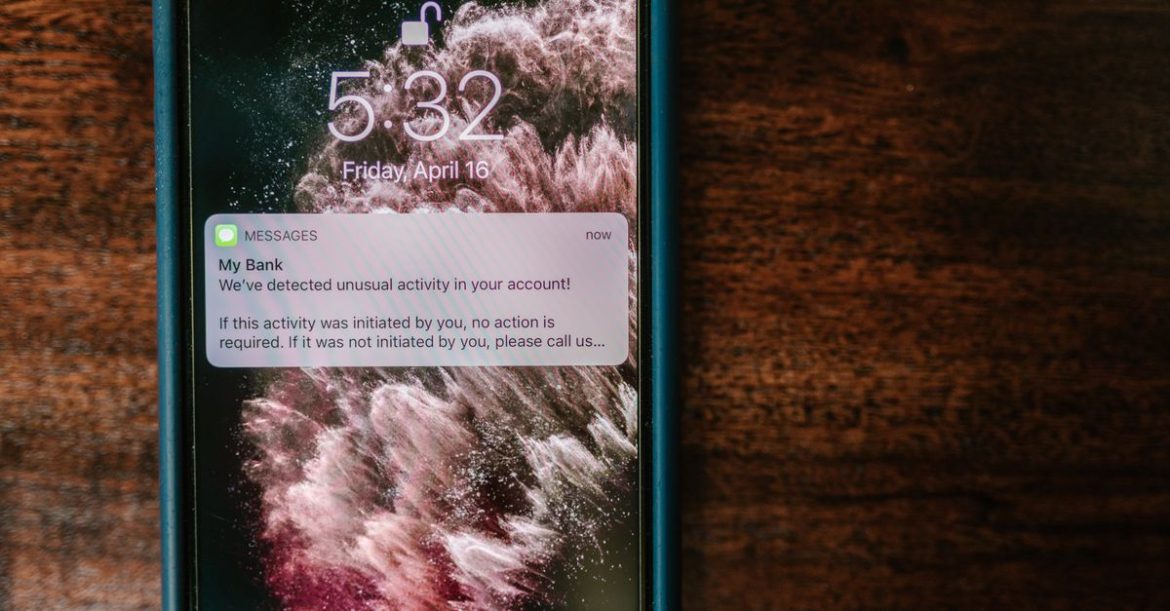 Smartphone lock screen showing a bank fraud alert notification, illustrating Android lockscreen rate limiting