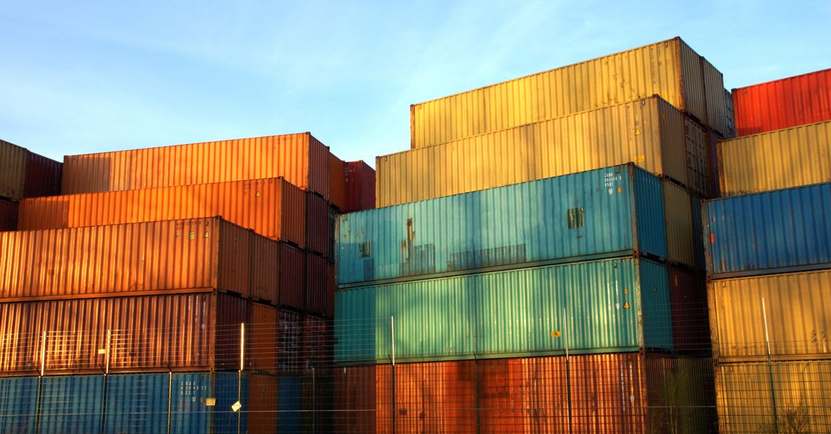 Stacked shipping containers, echoing the Docker container escape ENCFORGE ransomware's operators used to reach the host